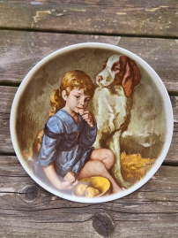 2 beautiful wall plates with an image of a young girl and dog😍